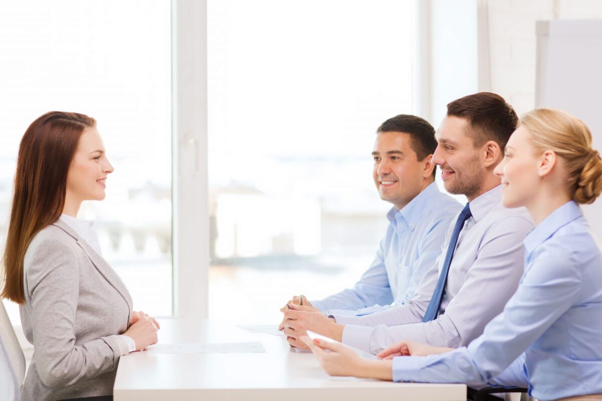 smiling businesswoman at interview in office